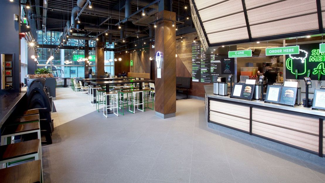A view of the interior of a shake shack in canary wharf our team worked on